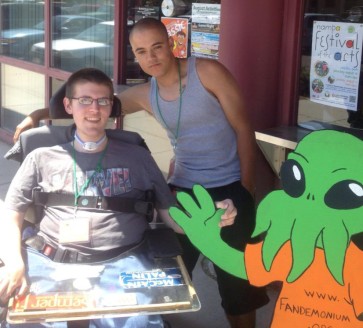 My friend Javier and I hanging out with  Fandemonium's mascot: Cthulhu!